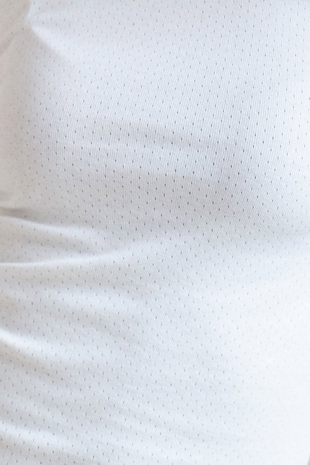 ekologisk topp slimfit långärmad jacquard vit närbild