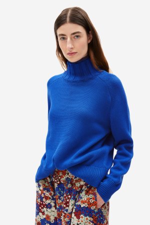 ekologisk tröja stickad halvpolo oversize caamile blå modell